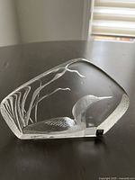 Front angled view of the lead crystal loon sculpture showing detailed etching and smooth crystal edges.