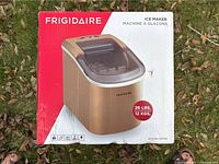 Front view of Frigidaire ice maker box showing product image and weight capacity (26 lbs/12 kgs)