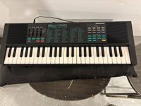 Yamaha PSR-270 keyboard showing full 49-key layout and control panel.