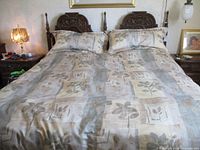 Full view of king bed with mattress and bedding