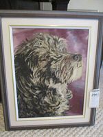 Full view of the framed oil painting showing the dog portrait subject and frame details