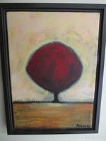 Framed oil painting showing full artwork of red round tree shape with textured yellow background.