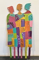 Front view of sculpture on display showing full colorful design