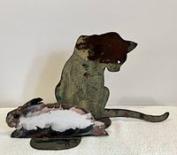 Main photo of the cat and bunny steel sculptures together showing size and color.