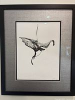 Full view of the framed black-and-white print featuring a stylized anatomical elephant with wide linen-textured mat and black wood frame.