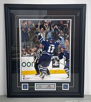 Full image of the framed Mats Sundin hockey photo showing the black frame, plaques, and autograph at bottom right