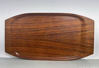 Top view of rectangular wooden tray displaying smooth polished teak surface with wood grain pattern