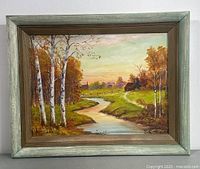 Framed landscape painting featuring birch trees and a winding river in autumn colors, signed by Taylor.