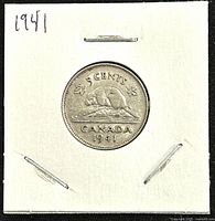Reverse view of the 1941 Canadian 5 cents coin showing the beaver design and denomination.