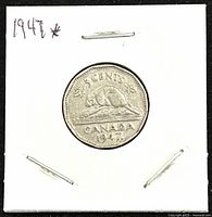 Reverse side showing beaver on rock with 5 cents and Canada inscription