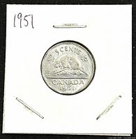 Reverse of the 1951 Canadian 5 cents nickel coin showing beaver design with value and date.