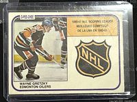 Front of 1981-82 O-Pee-Chee Wayne Gretzky NHL scoring leader trading card with image of Gretzky in Edmonton Oilers jersey and NHL logo.