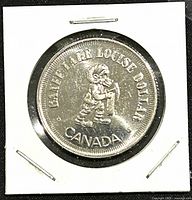 Obverse side of the 1983 Karen Louise trade dollar coin showing a child figure and text 'KAREN LOUISE DOLLAR CANADA'
