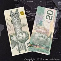 Two Canadian 20 dollar banknotes side by side on a dark world map background