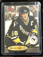 Front view of 1996 Fleer Mario Lemieux Pittsburgh Penguins trading card, number 87, in protective sleeve.