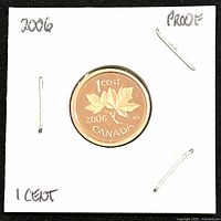 Obverse side showing maple leaf and denomination with year on the 2006 proof 1 cent coin.