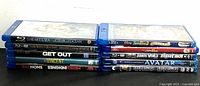 10 Blu-ray movie cases stacked showing titles on spine.