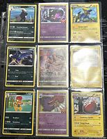 Photo showing the front sides of 9 Pokémon cards including Pangoro, Dusknoir, Manectric, Murkrow, Scrafty, Gengar, Electrode, and two cards with glare obscuring details.