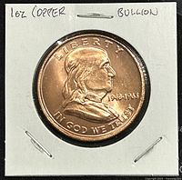 Obverse side photograph of the copper coin showing Benjamin Franklin profile with date 1948-1983 and inscriptions LIBERTY and IN GOD WE TRUST
