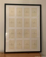 Front view showing black framed collage holder with 16 slots for 4x6 photos in a 4x4 grid.