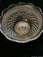 Top view showing the clear pressed glass with diamond pattern and scalloped rim of the fruit bowl.