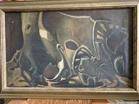 Framed contemporary oil painting on canvas with abstract forms in muted dark colors, showing minor surface wear and wood frame.
