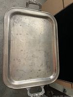Full view of the silver plated rectangular serving tray with slightly worn surface and patina.