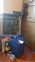 Folding camp chair with umbrella holder and side table, Coleman propane, unopened gel heat sternos, 5x7 tarp, additional propane canister