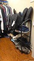 Shoe rack loaded with multiple pairs of shoes to demonstrate capacity but shoes are not included.