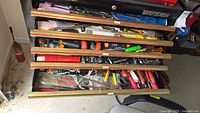 Five drawers filled with assorted hand tools including pliers, screwdrivers, and miscellaneous small tools. Chest not included.