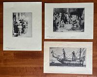Four different limited edition prints with Dutch inscriptions on wooden table.