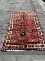 Full front view of rug laid on stone patio