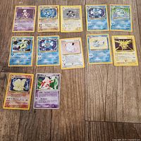 Overview of all holographic cards laid out on floor