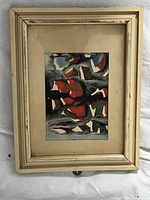 Full view of the framed abstract painting showing the artwork, mat, and distressed cream wooden frame.