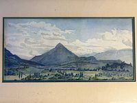 Close-up photo focusing on the watercolour artwork itself, highlighting the details of the mountain, fields, trees and small houses.