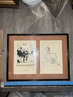 Framed artwork with two sketches by Ben Wicks including title and signatures visible.