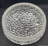 Top view of clear Iittala Ultima Thule bowl showing circular pattern and textured interior bottom
