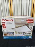 Front and top view of the retail box showing brand ReVent, product image of bath fan grille, airflow rating of 110 CFM, sound rating 1.3 sones, and SheetLock installation feature.