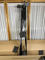 Eight clubs standing upright in a cardboard box with foam spacers