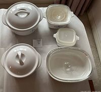 Top view showing the various casseroles and baking dishes with lids, highlighting their sizes and shapes.