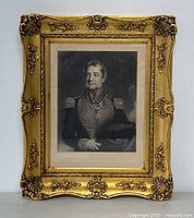 Full view of the framed etching showing ornate gold frame and the entire portrait with label below.