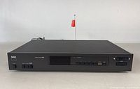 Front view of the NAD 4155 stereo tuner showing full width including the display and controls.