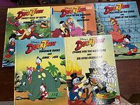 Photo showing 5 Disney DuckTales children's books with colorful covers and various illustrated characters.