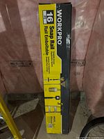 Box front showing WORKPRO brand, 16 piece snap rail system for garage organization with illustrative icons and text.