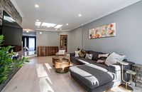 Full view of the dark grey L-shaped sectional in living room