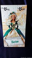Photo of the front of the outer packaging showing the Barbie doll illustration and branding.