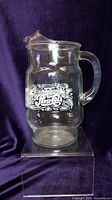 Front view of vintage Pepsi-Cola glass pitcher showing logo and overall shape