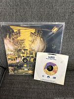 Full view of Paisley Park LP album cover and 45 RPM single in sleeve showing both records.