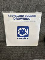 Front cover of Cleveland Lounge 'Drowning' vinyl LP in original sleeve with Moonshine logo.
