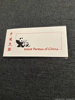 Front side of coin display sleeve showing two pandas and the text 'Giant Pandas of China'.